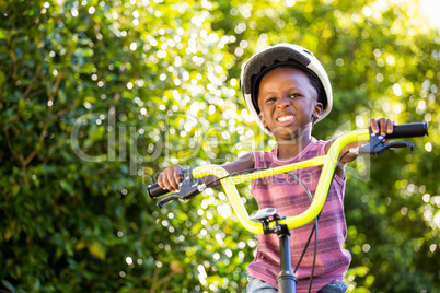 Child is riding a bike