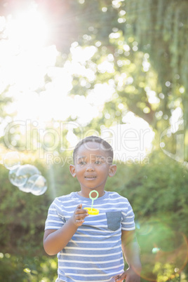 Portrait of child  making bubble