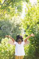 Boy playing as an aviator at park