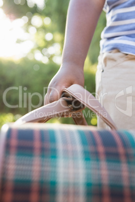 child is holding a bag