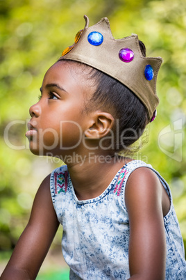 Girl wearing a king crown