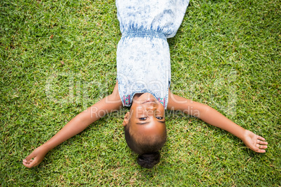 Girl is  lying at park