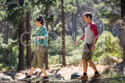 Couple smiling and walking with balance