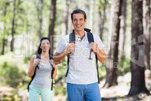 Couple smiling and hiking