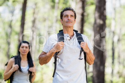 Couple posing with backpack