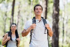 Couple posing with backpack