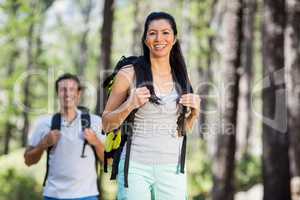 Couple smiling and posing with their backpack