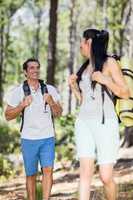 Couple smiling and hiking