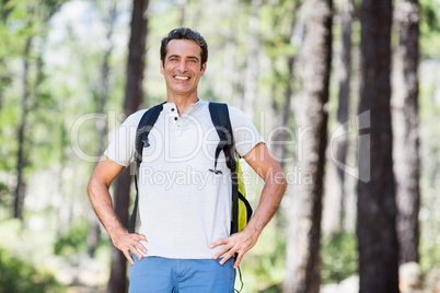 Man smiling and posing with his hands on hips