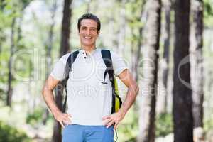 Man smiling and posing with his hands on hips