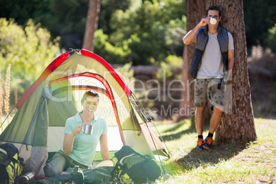 Couple posing and holding cup