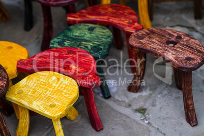 Old fashion colored chairs at market