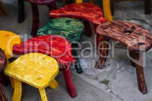 Old fashion colored chairs at market