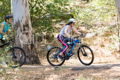 Profile view of Couple riding bike