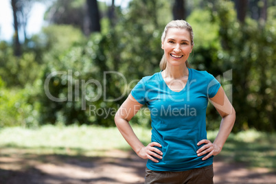 Woman smiling and posing with hands on hips