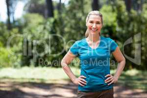 Woman smiling and posing with hands on hips