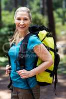 Woman smiling and posing with a backpack