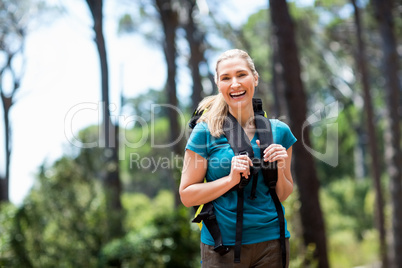 Woman smiling and hiking