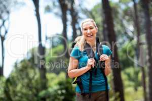 Woman smiling and hiking