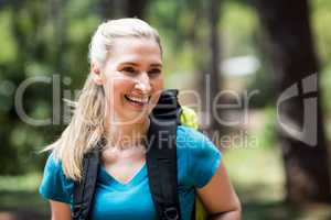 Portrait of a woman smiling with a backpack