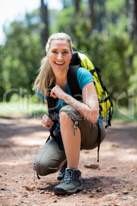 Woman smiling and squatting