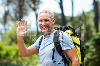 Portrait of a man smiling and greeting