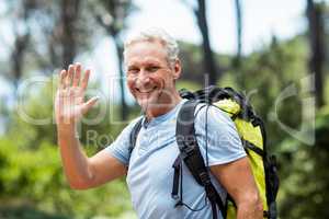 Portrait of a man smiling and greeting