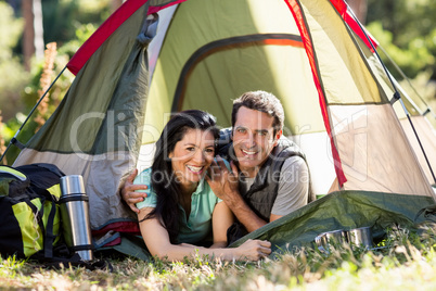 Couple smiling and laying