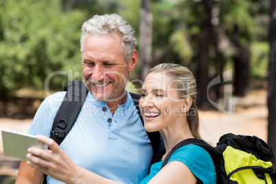 Couple smiling and taking a photo