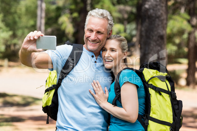 Couple smiling and taking a photo