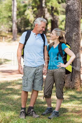 Couple smiling and holding hands each other