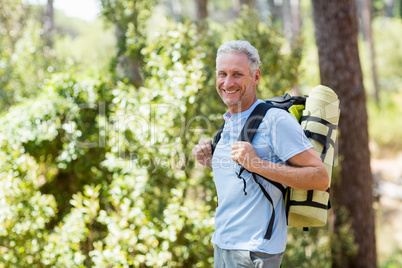 Man smiling and hiking