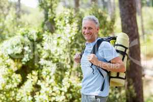 Man smiling and hiking