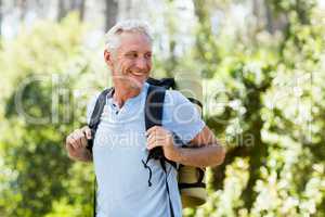 Man smiling and hiking