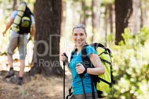 Woman smiling and hiking