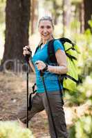 Portrait of a woman smiling and hiking