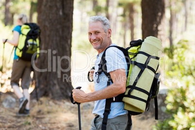 Man smiling and hiking