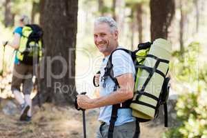 Man smiling and hiking