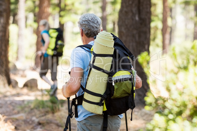 Couple front the back hiking