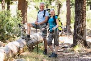 Couple smiling and posing during a hike