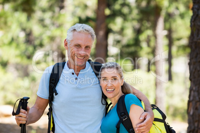 Portrait of couple smiling and holding arms