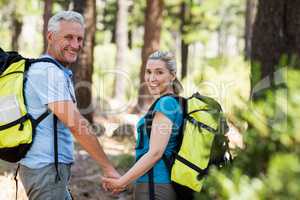 Couple smiling and holding hands each other