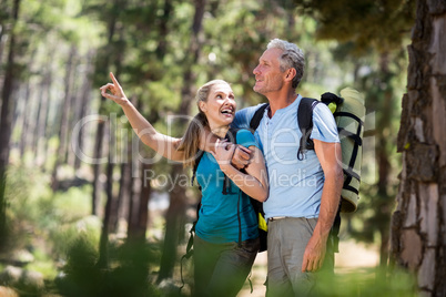 Couple pointing and holding each other