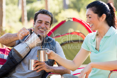 Couple smiling and taking some drink