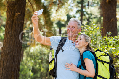 Couple smiling and taking a photo