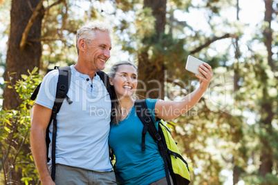 Couple smiling and taking a photo