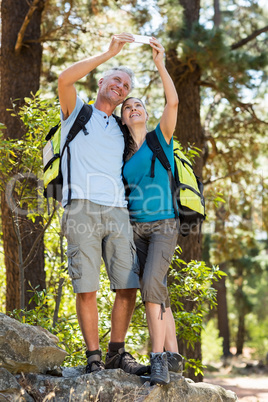 Couple smiling and taking a photo