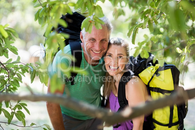 Couple smiling and posing during a hike