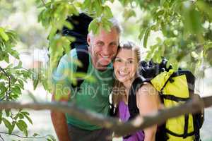 Couple smiling and posing during a hike