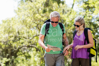 Couple looking a map during a hike